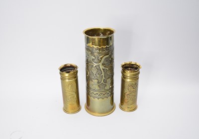 Lot 477 - Trench Art:- A WWI brass artillery shell, dated 1914-1918, a similarly dated pair and a matchbox (4)