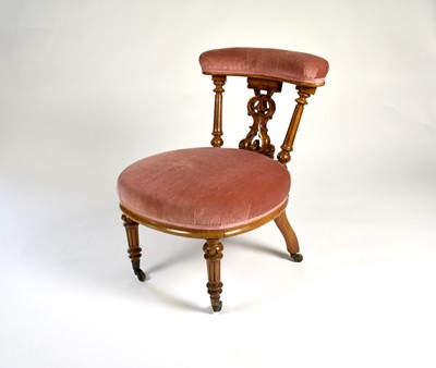 Lot 212 - A Victorian carved walnut chair, with a rounded seat covered in rose pink dralon