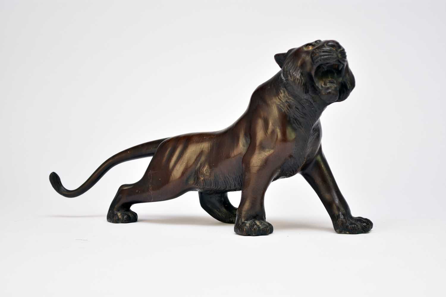 Lot 390 - A Japanese bronze figure of a tiger, Meiji period