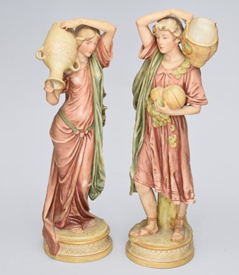 Lot 313 - A pair of Royal Dux figures of water and fruit carriers