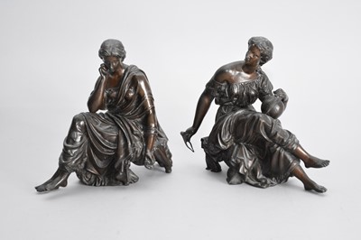 Lot 411 - A pair of patinated spelter figures of muses