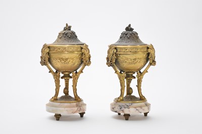 Lot 440 - A pair of gilt metal and white veined marble urns and covers, circa 1900