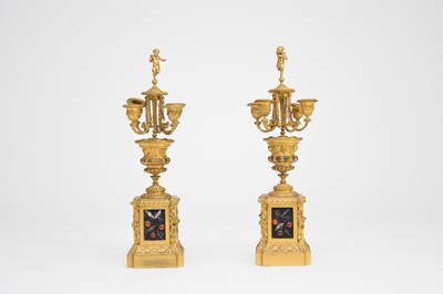 Lot 324 - A pair of late 19th century, French ormolu four-branch candelabra