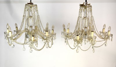 Lot 474 - A pair of large cut glass eight-light chandeliers