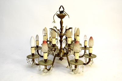 Lot 478 - A gilt metal sixteen-light chandelier