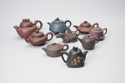 Lot 330 - A collection of nine Yixing pottery teapots, 20th century