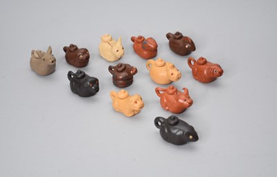 Lot 72 - A set of twelve Chinese Yixing pottery zodiac animal water droppers