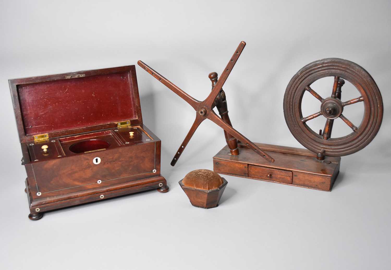 Lot 101 - A Victorian tea caddy, part of a lace-maker's bobbin winder and a pin cushion (3)