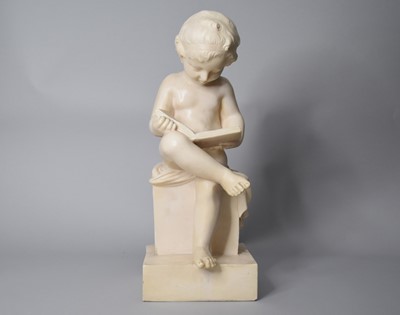 Lot 81 - A resin model of a child reading a book, 46cm high, on a resin pedestal (2)