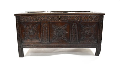 Lot 224 - A 17th century, later carved, oak coffer