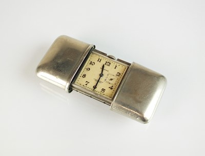 Lot 151 - A white metal Movado Chronometre Ermeto purse watch