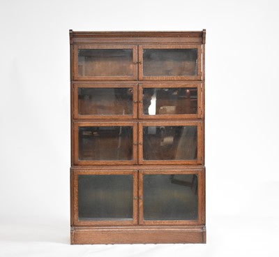 Lot 626 - An early 20th century Minty oak glazed stacking bookcase