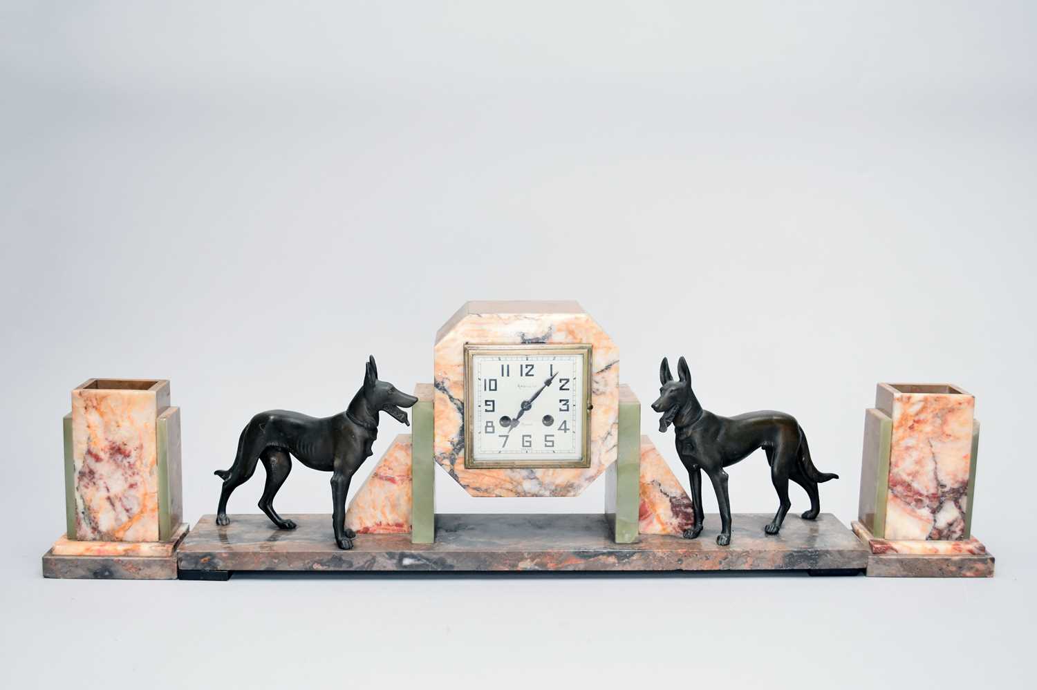Lot 589 - A French art deco mixed marble and spelter clock garniture