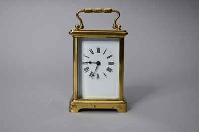 Lot 153 - A French gilt brass carriage timepiece