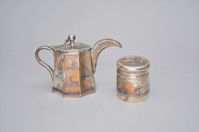 Lot 321 - A white metal teapot and tea cannister
