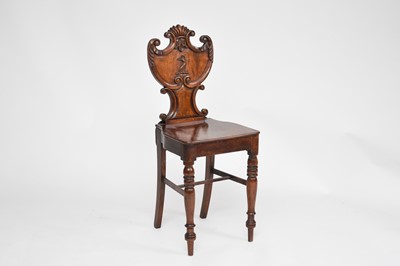 Lot 643 - A Victorian oak and walnut crested hall chair