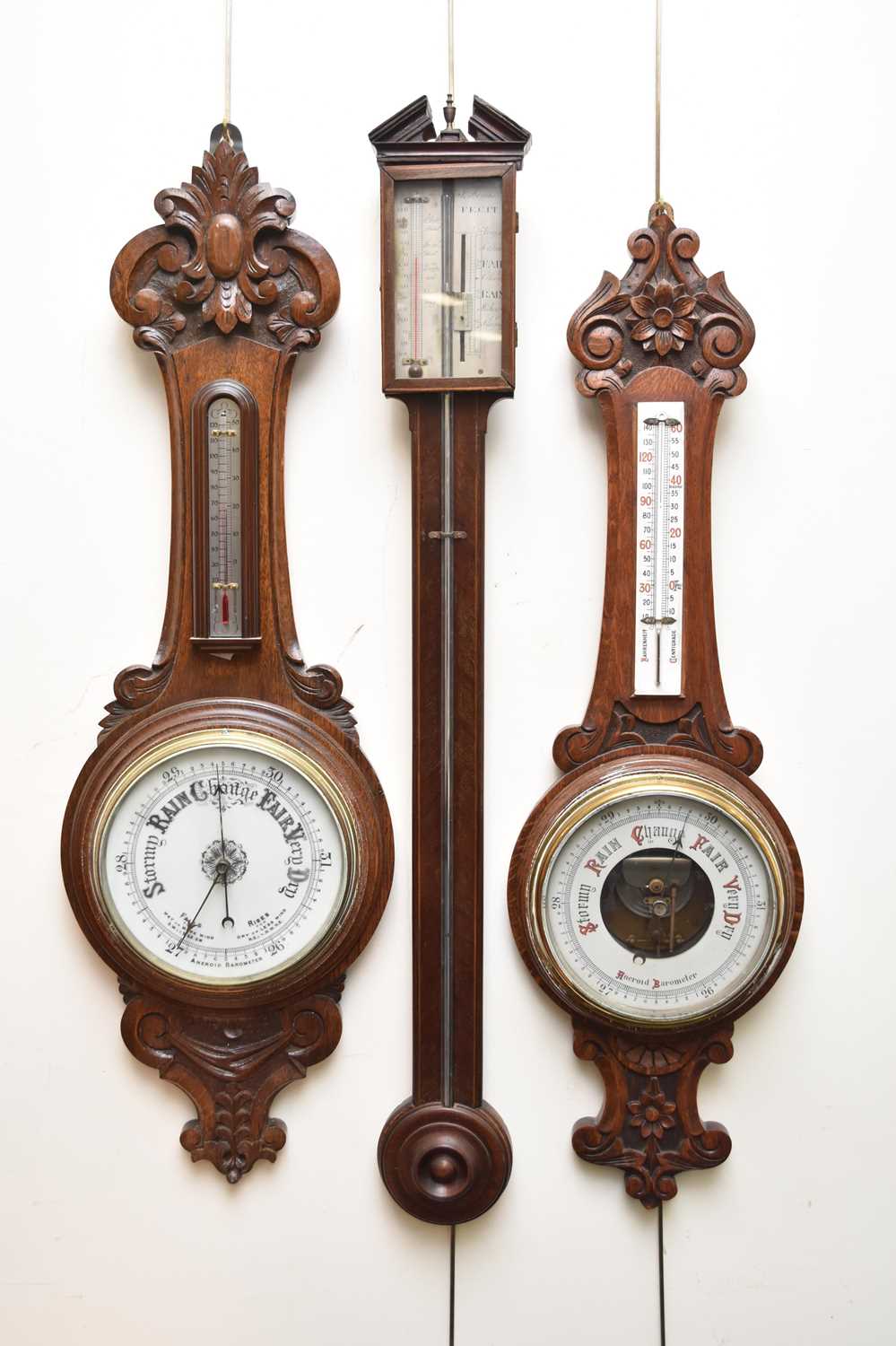 Lot 588 - Two aneroid barometers and a stick barometer