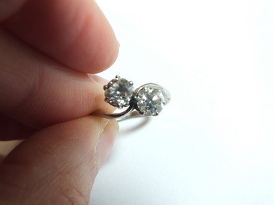 Lot 74 - A two stone diamond crossover ring