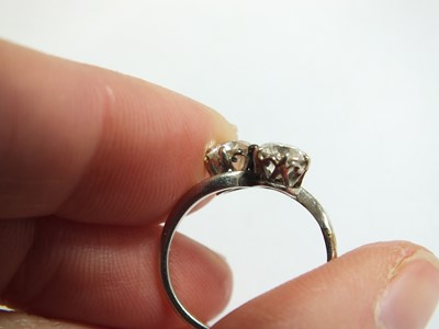 Lot 74 - A two stone diamond crossover ring