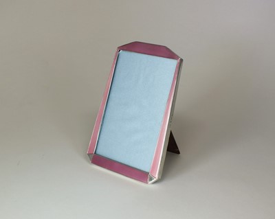 Lot 15 - An Art Deco pink enamel and silver mounted frame