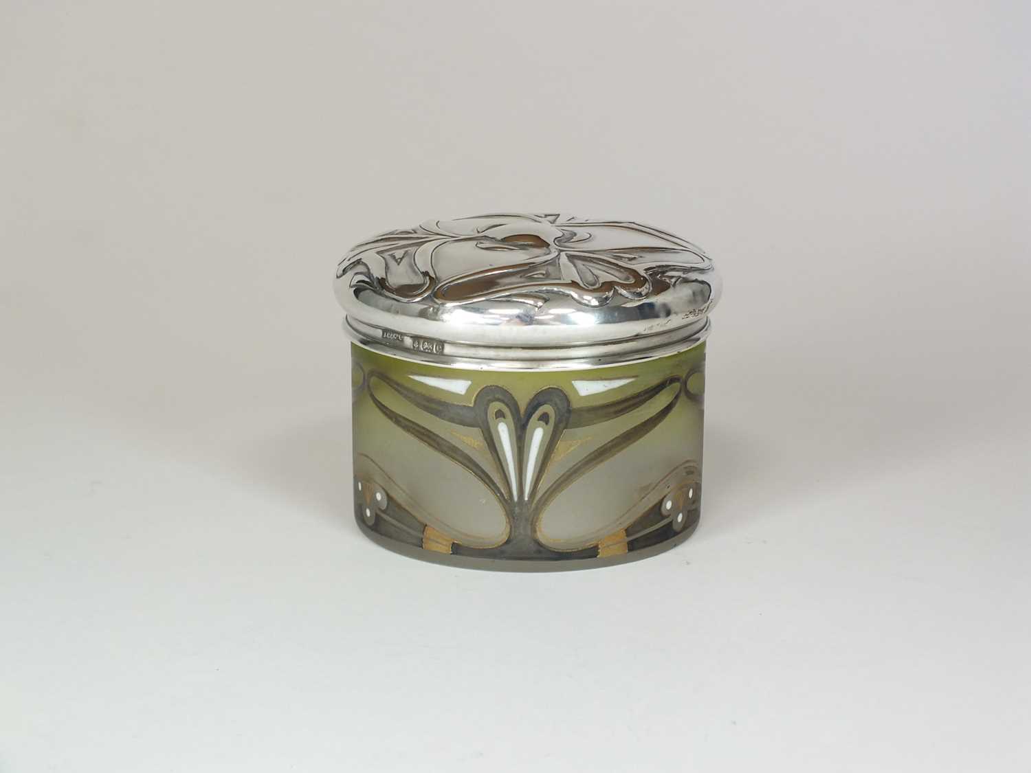 Lot 4 - An Art Nouveau silver topped glass dressing table jar