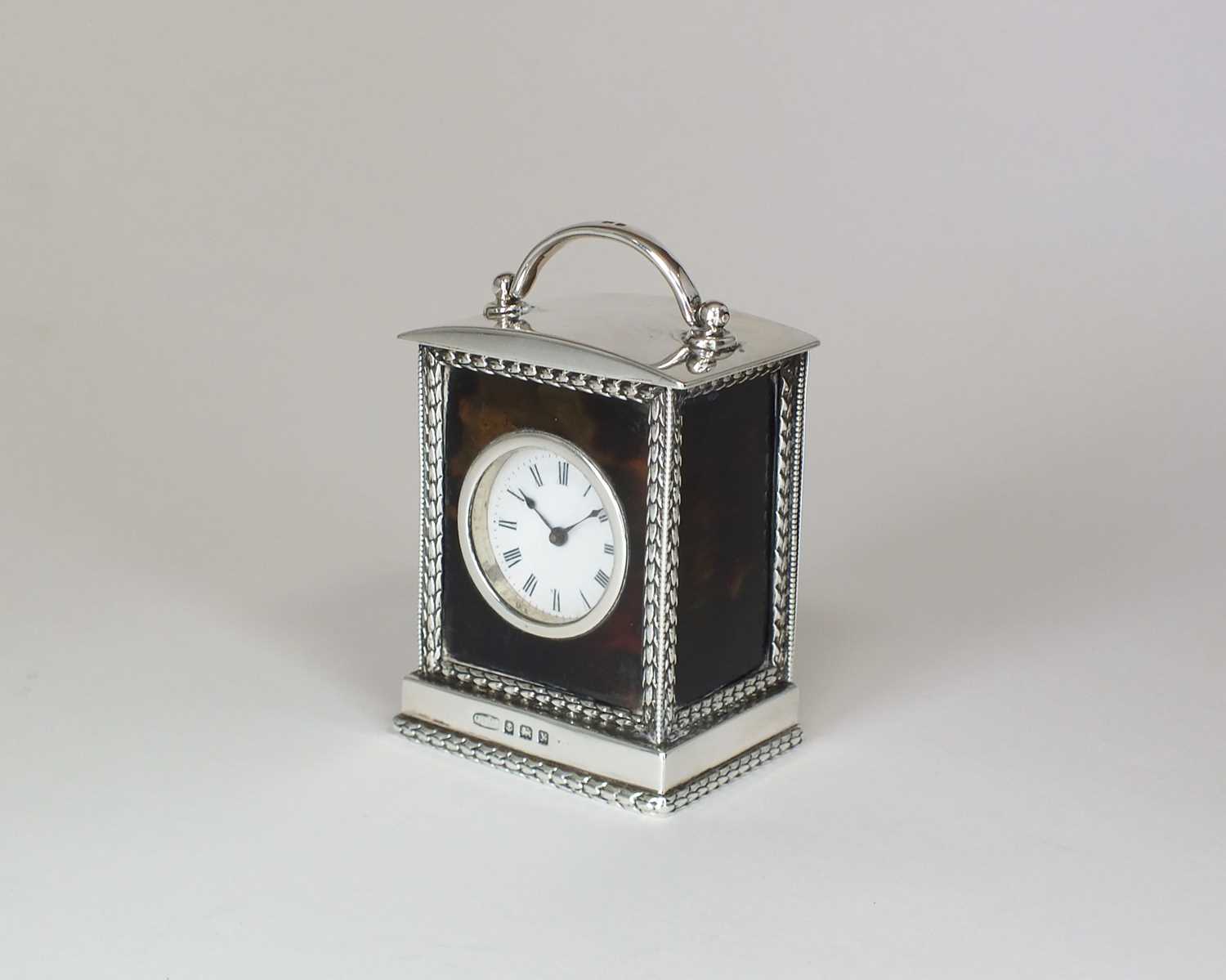 Lot 9 - A silver and tortoiseshell mounted carriage timepiece