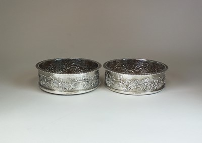Lot 22 - A pair of late Victorian silver mounted Magnum wine coasters