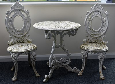 Lot 622 - A pair of Coalbrookdale style, painted cast iron garden chairs and a garden table