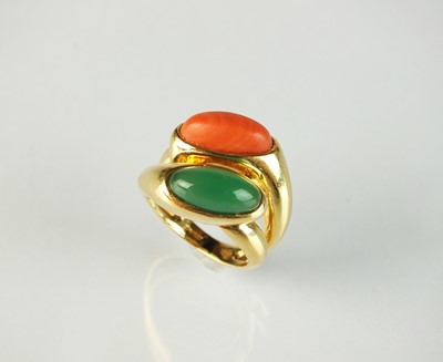 Lot 139 - An 18ct gold coral and chrysoprase crossover dress ring by Boucheron