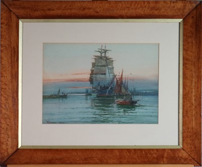 Lot 211 - William Knox (British 1862-1925) Ships and Boats at Sunset with lighthouse beyond