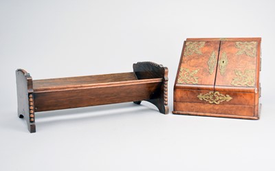 Lot 526 - A late Victorian walnut stationary box and an oak book stand