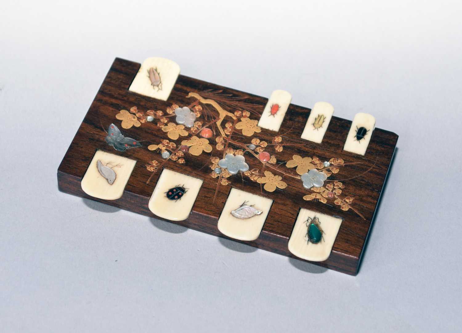 Lot 471 - A Japanese rosewood shibayama whist counter