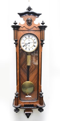 Lot 281 - A parcel ebonised rosewood and mahogany single-weight Vienna wall clock