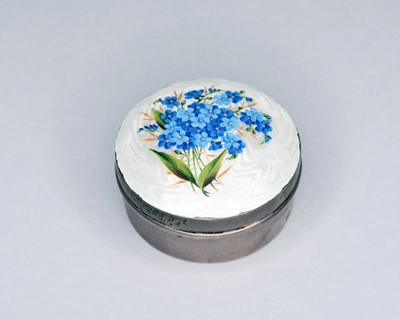 Lot 357 - A silver and guilloche enamel circular box and cover