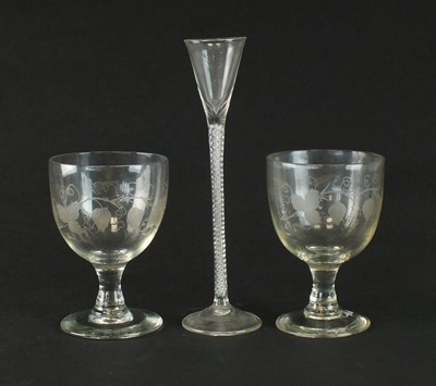 Lot 162 - A pair of 19th century engraved glass goblets and an air-twist glass