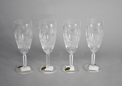 Lot 403 - Four Waterford Crystal champagne flutes in the...