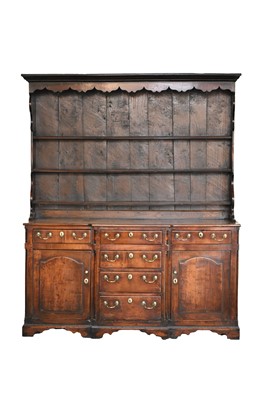 Lot 460 - A late 18th century fruitwood or yew wood breakfront dresser, North Wales