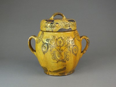 Lot 282 - A slipware twin-handled jar and cover, possibly Ewenny