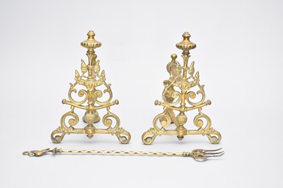 Lot 519 - A pair of brass fire dogs