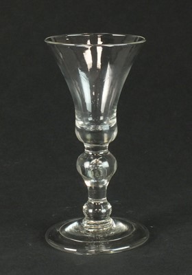 Lot 322 - A heavy baluster wine glass, circa 1710