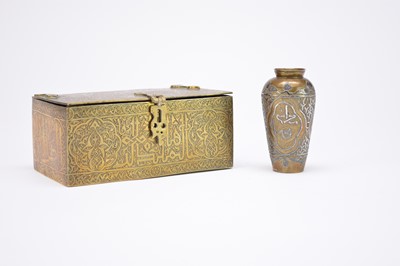 Lot 404 - A Persian brass casket and a small inlaid brass vase