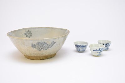 Lot 329 - A Chinese blue and white bowl and three wine cups, Ming Dynasty