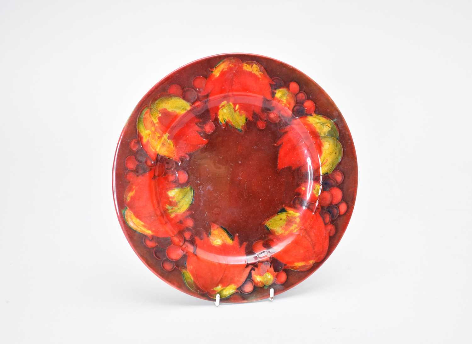 Lot 428 - A Moorcroft flambe plate