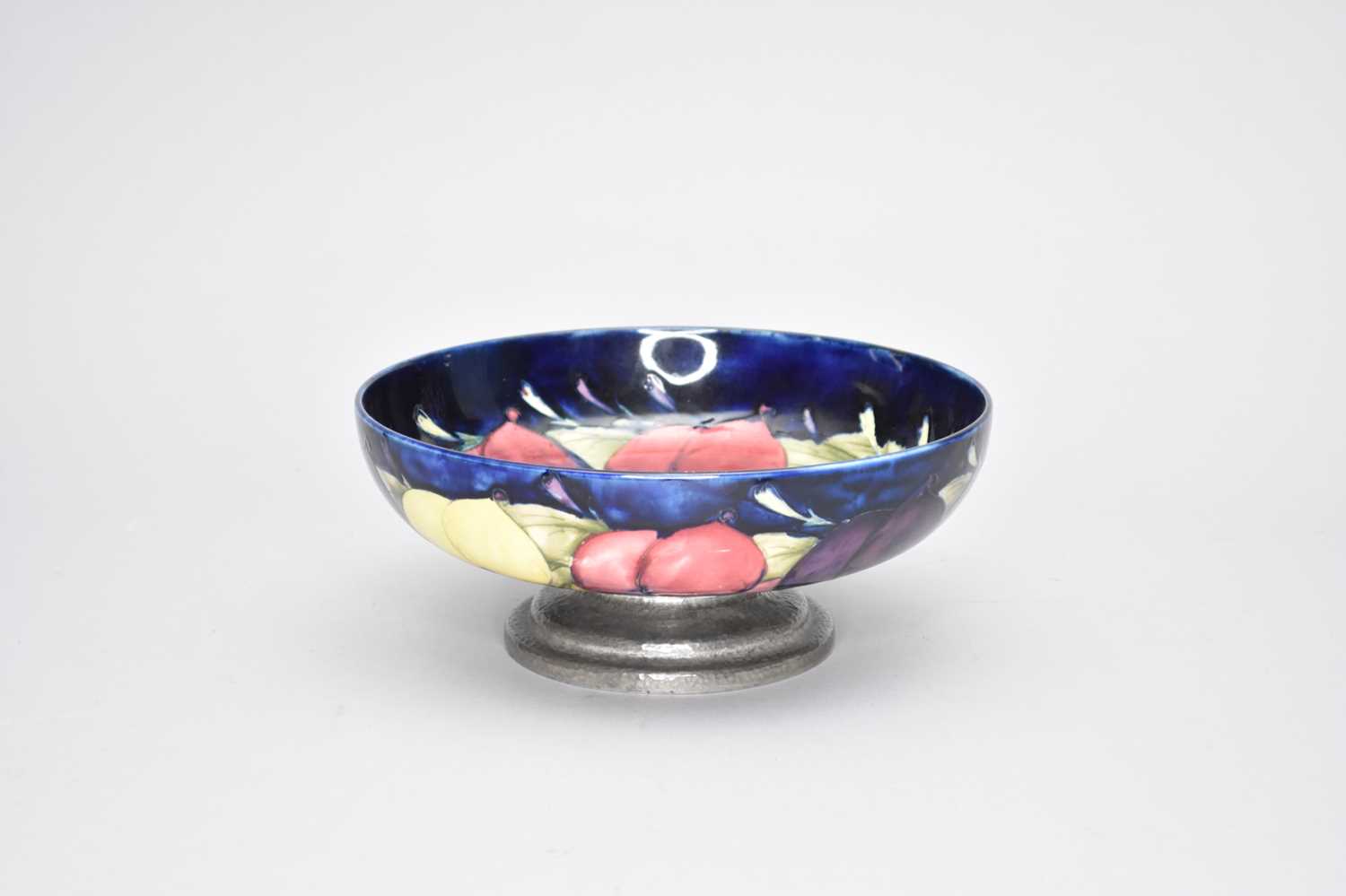 Lot 427 - A Moorcroft 'Wisteria' Tudric pewter mounted bowl