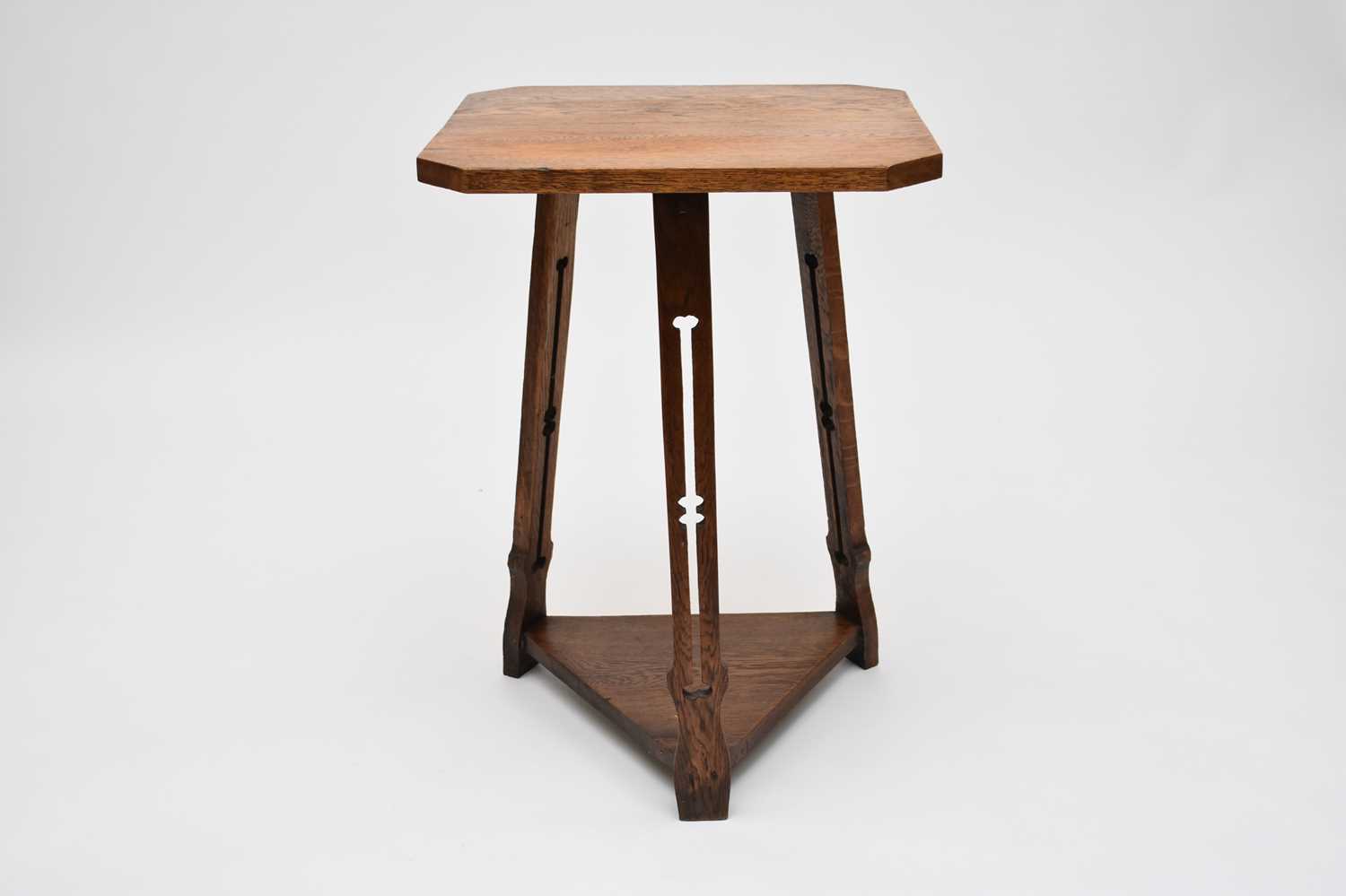 Lot 614 - A good light oak Arts and Crafts cricket type table