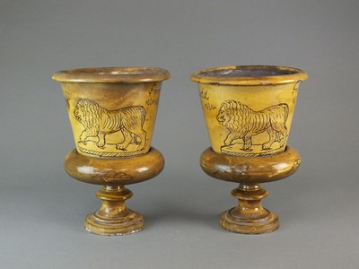 Lot 283 - A pair of Buckley slipware flower pots