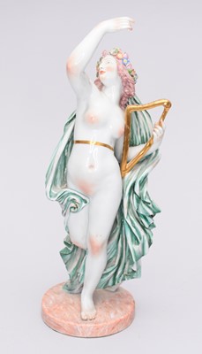 Lot 311 - A Capodimonte porcelain figure of a semi-clad maiden playing a harp