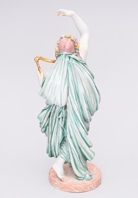 Lot 311 - A Capodimonte porcelain figure of a semi-clad maiden playing a harp