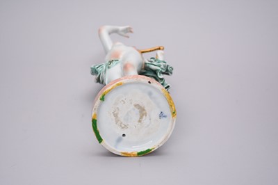 Lot 311 - A Capodimonte porcelain figure of a semi-clad maiden playing a harp