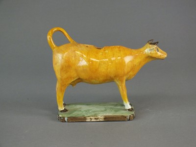 Lot 284 - An English pearlware cow creamer, early 19th century